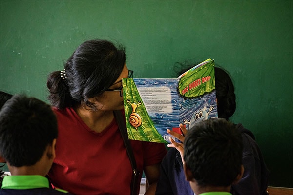 a volunteer teaches her student at Shishu Mandir