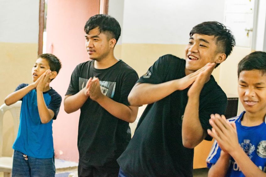 children at the home dancing and singing