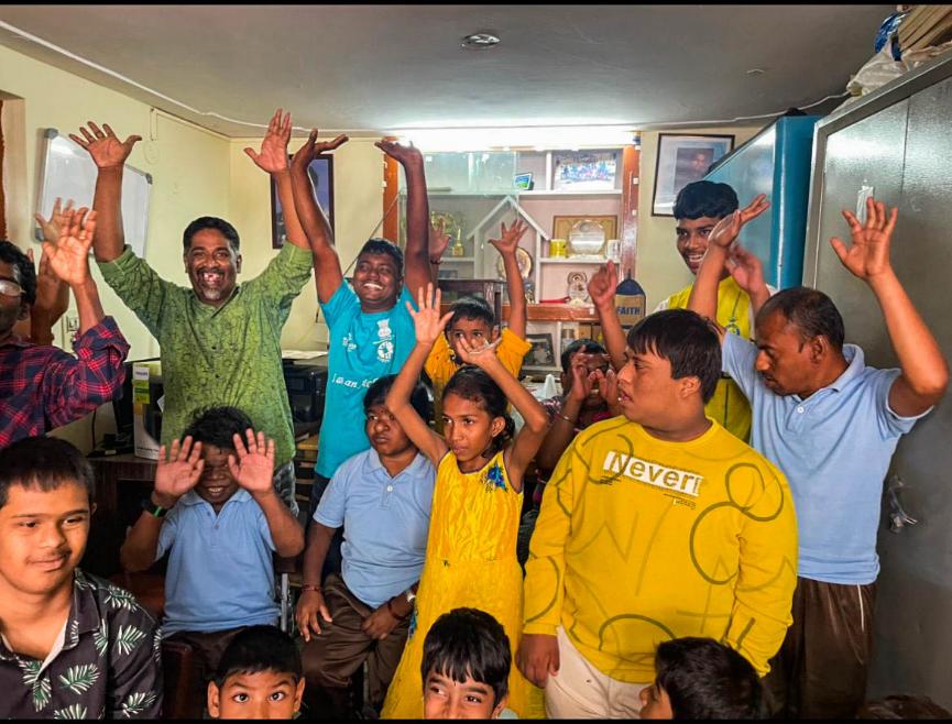 Nireekshana children raising hands while singing